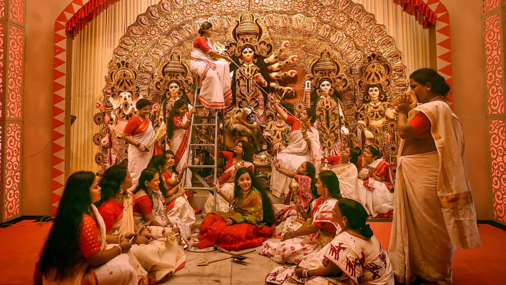 Hindu people praising Durga